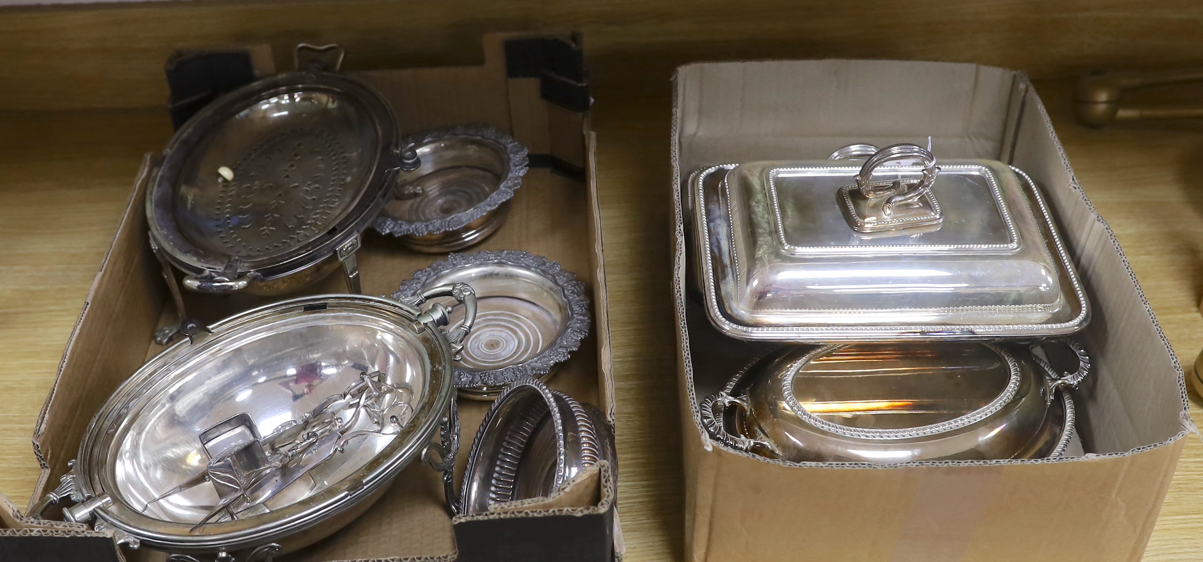 Sundry plated wares including two breakfast dishes, wine coasters and candle wick trimmers, largest 35cm wide